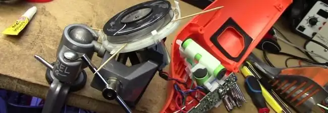 Vacuum cleaner repair parts and tools on a workbench in Chula Vista, CA
