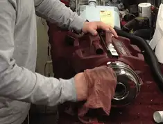 Vacuum repair technician cleaning and servicing a vacuum motor in Chula Vista, CA